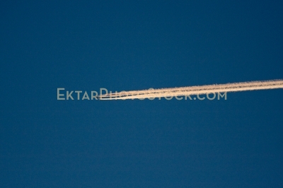Airplane trail in the deep blue sky