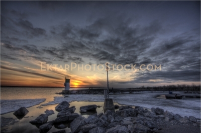 Aylmer Marina Sunset With Lighthouse rocks and ice