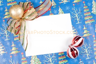 Christmas greeting card with ornaments on blue