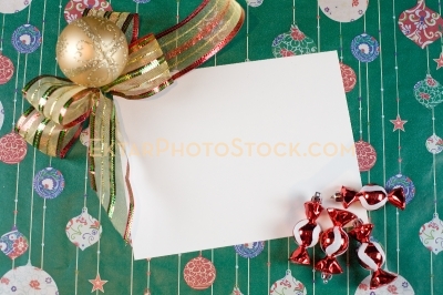 Christmas greeting card with ornaments on green