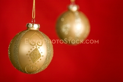 Christmas greeting card with two balls on red closeup