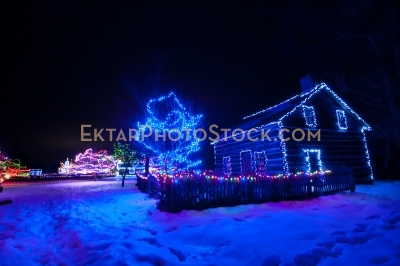 House decorated with colorful Christmas lights blue lights