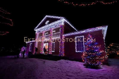 Mansion decorated with colorful Christmas lights