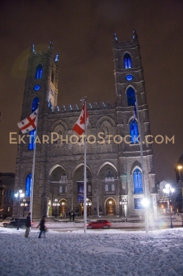Night winter square view in Montreal snow Basilique Notre-Dame