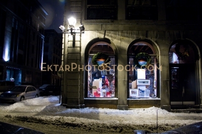 Night winter street view in Montreal snow store front