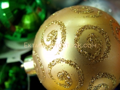 Yellow sparkly Christmas ball closeup